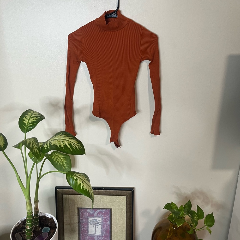 Orange long sleeve turtle neck body suit top
